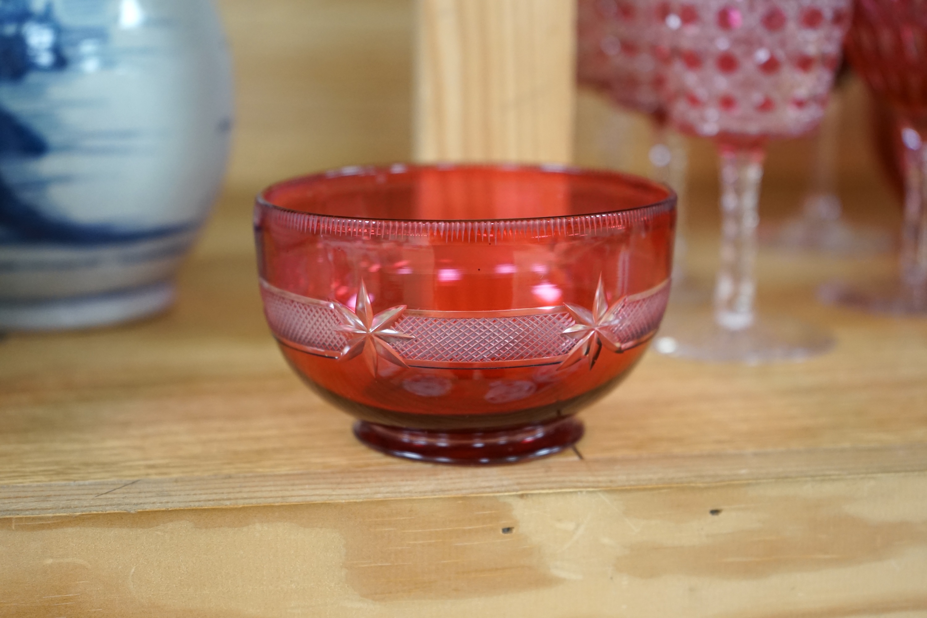 Two cranberry glass liqueur decanters and a collection of various glasses and a bowl, decanters 25cm high. Condition - good